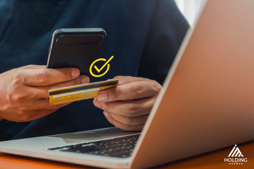 someone checking his credit card to purchase a certain service on an ecommerce website